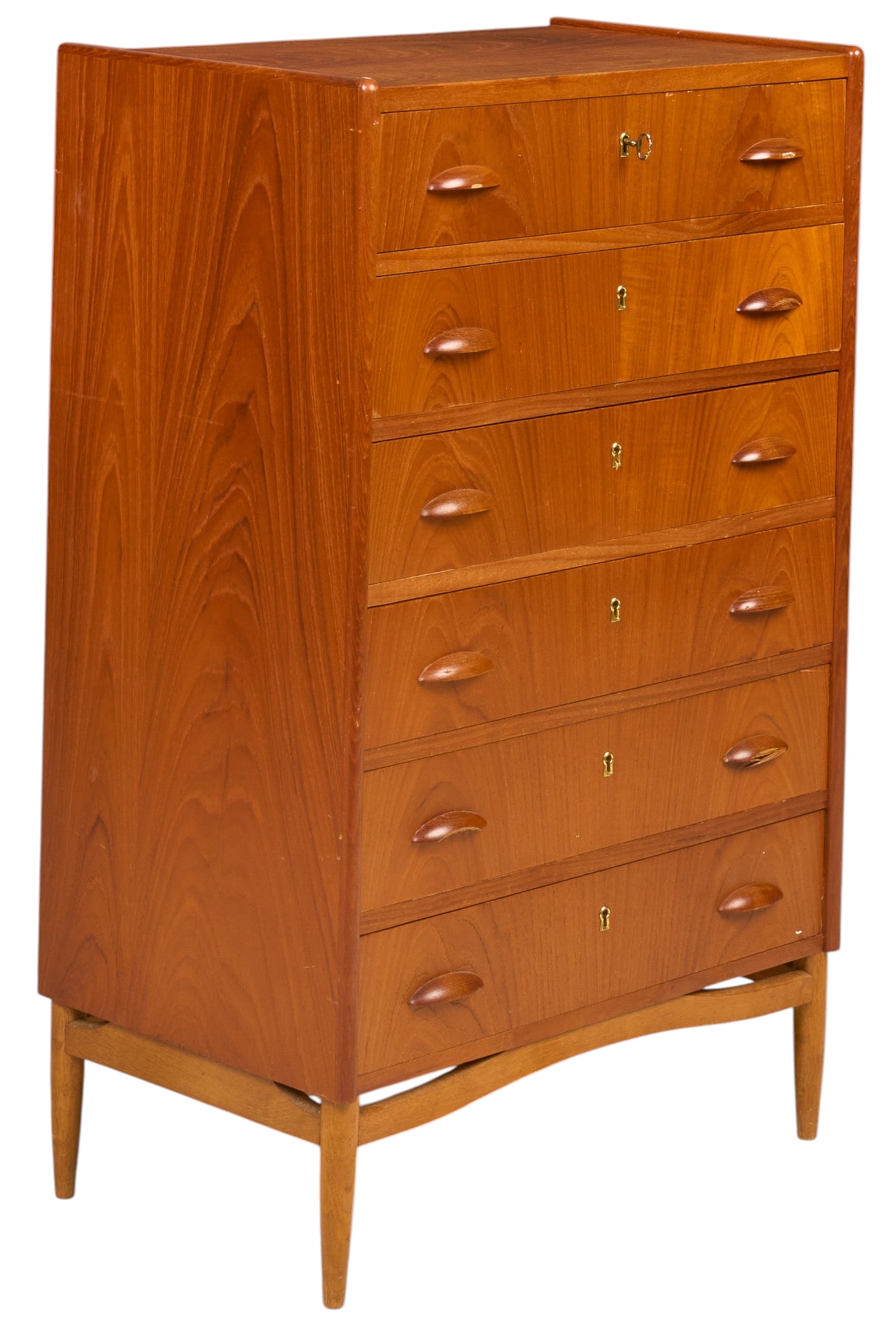 Danish Mid-Century Dresser: Danish mid-century dresser with stack of six drawers with wooden pulls, supported on pin legs height 41.25 in. x width 26.5 in. x depth 16 in. Condition: damage to several pulls 
