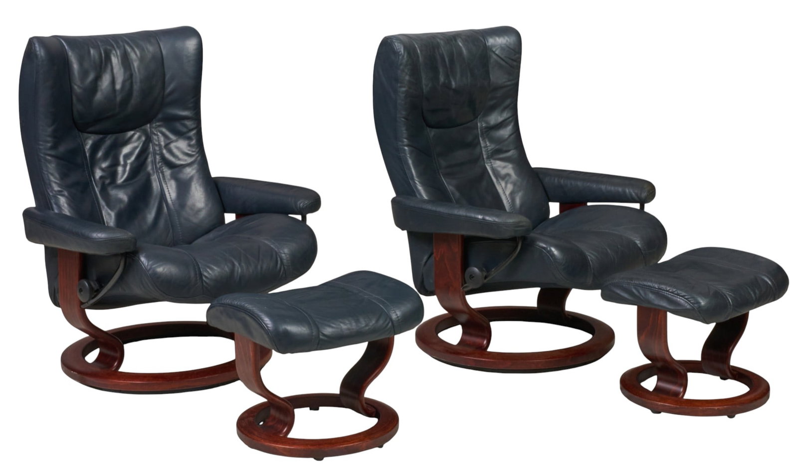 Pair of Ekornes Stressless Lounge Chairs and Ottomans: Pair of Ekornes (Denmark) "Stressless" lounge chairs with matching ottomans, upholstered in dark blue leather with bentwood swivel bases height 40.5 in. x width 34 in. x depth 32 in.