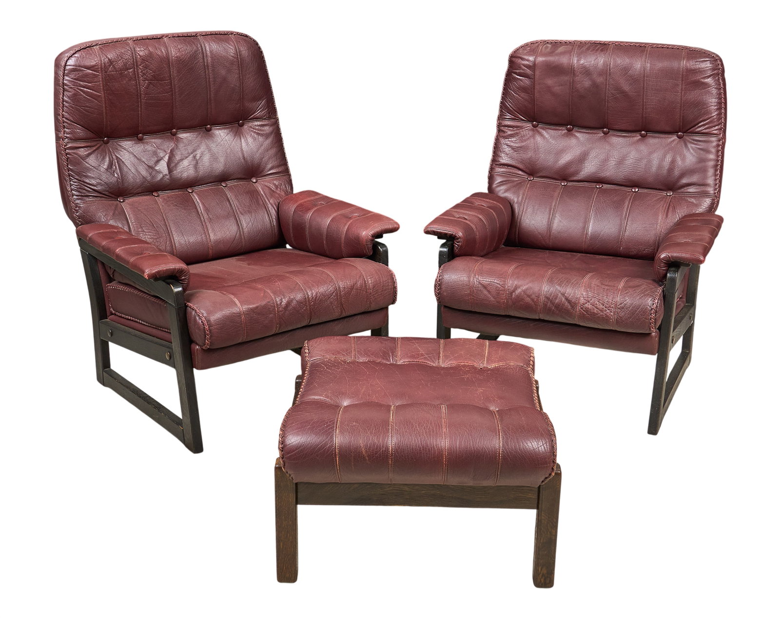 Pair of Mid-Century Brown Leather Chairs with Ottoman: Pair of Mid-century brown leather chairs with ottoman, and tufted cushions height 38.5 in x width 31 in. depth 32 in. / each Provenance: Property from a home in San Antonio, Texas
