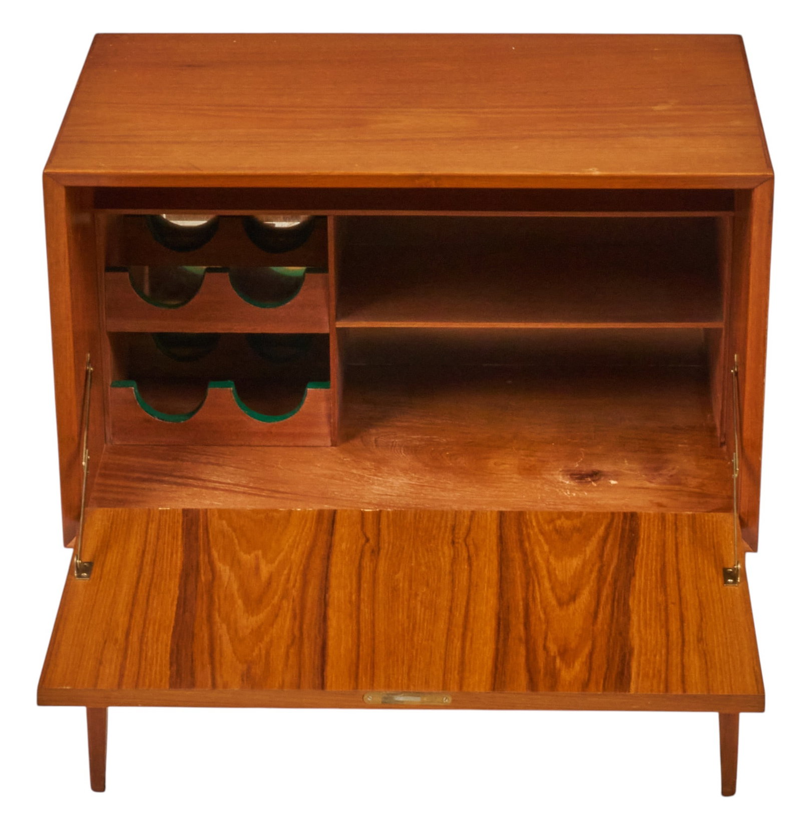Danish Mid-Century Wine Cabinet: Danish mid-century wine cabinet with bottle storage and single shelf behind drop-front cabinet door, supported on pin legs height 28 in. x width 27.5 in. x depth 17 in. 