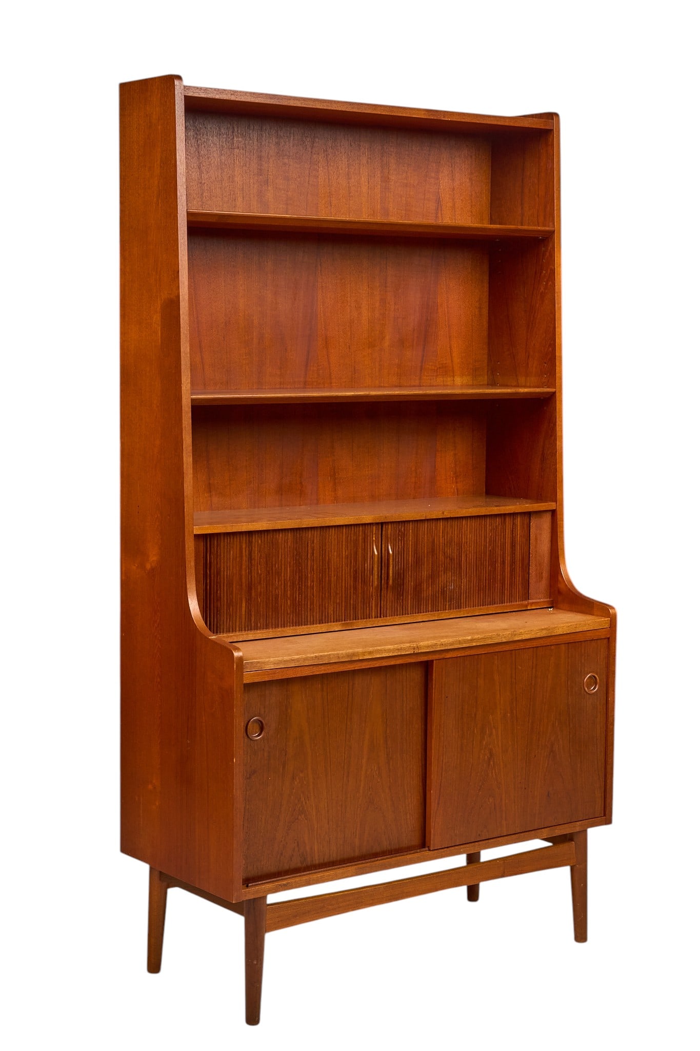 Danish Mid-Century Secretary Bookcase: Danish mid-century secretary bookcase with two open shelves above narrow tambour door that reveals fitted storage above extending writing surface, and lower cabinet with sliding doors and interior