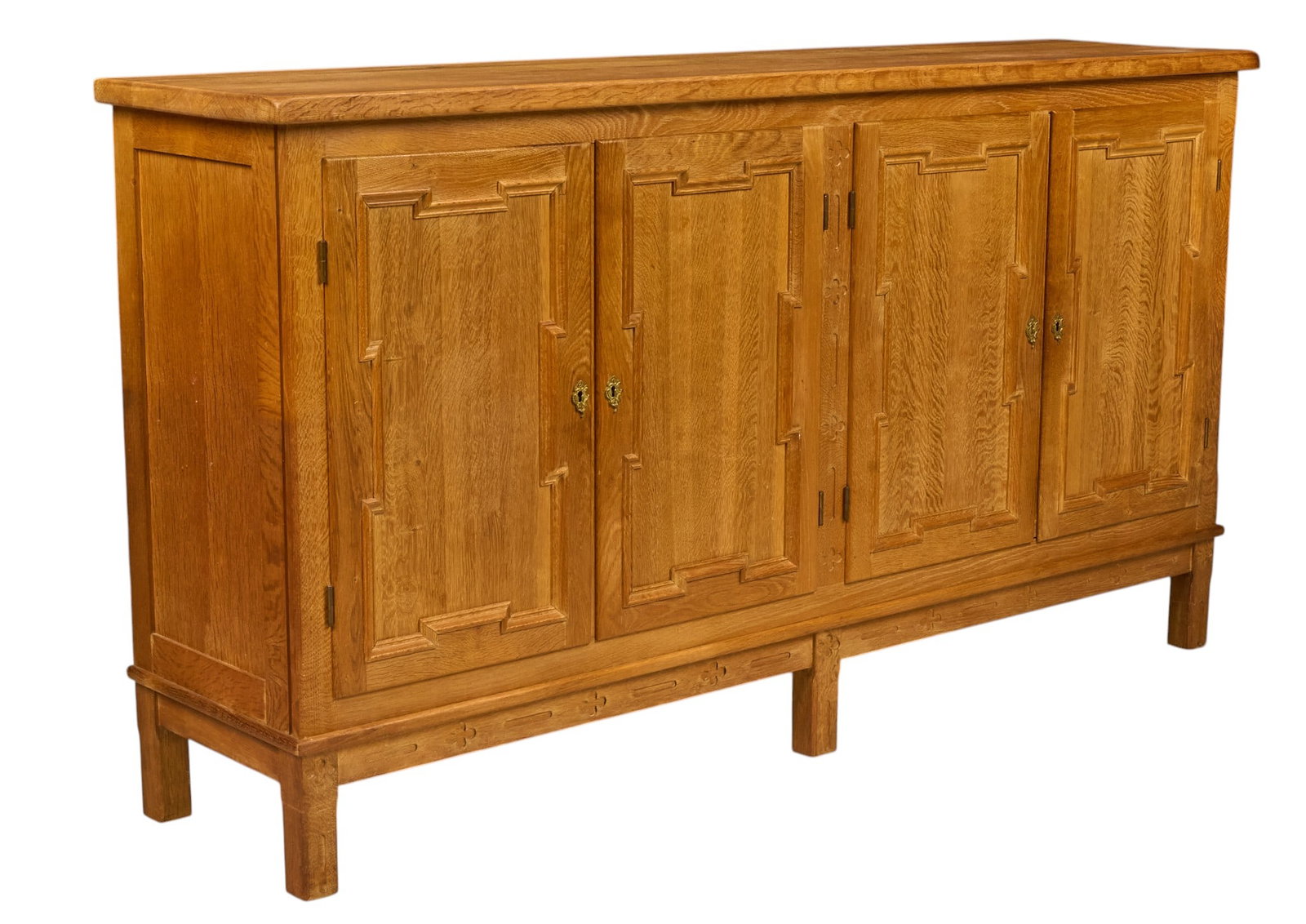 Henning Kjaernulf, Mid-Century Credenza: Henning Kjaernulf (Denmark) oak mid-century credenza with four carved panel cabinet doors opening to fitted interior storage, supported on block legs height 43 in. x width 79 in. x depth 19 in.