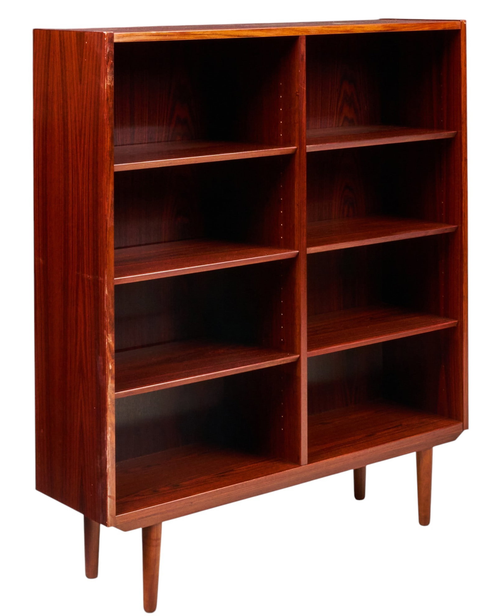Danish Mid-Century Bookcase: Danish mid-century bookshelf with six adjustable shelves, supported on pin legs height 50 in. x width 42.5 in. x depth 12 in. 
