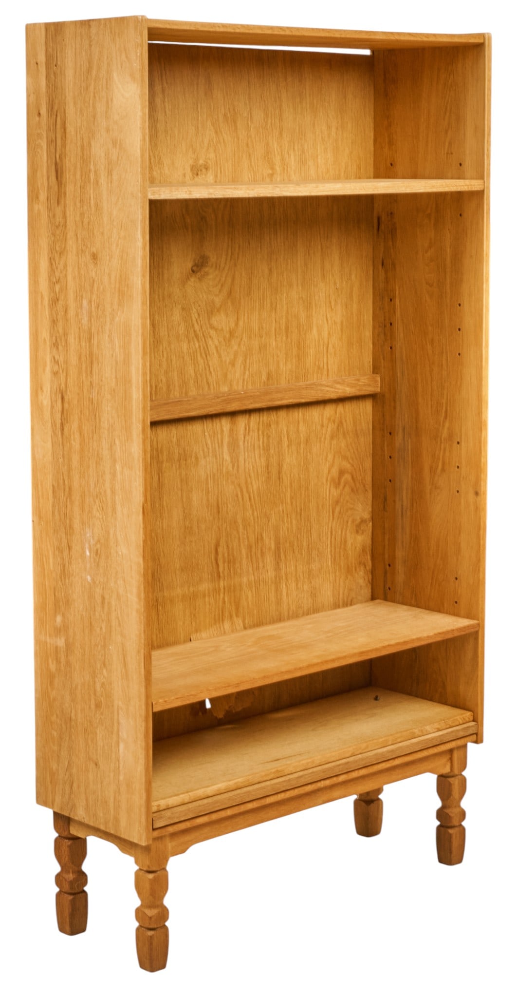 Danish Mid-Century Bookcase: Danish mid-century bookcase with four shelves, supported on carved block legs height 66.5 in. x width 35.5 in. x depth 12.5 in. Condition: damage to backboard that also doesn't sit within fr
