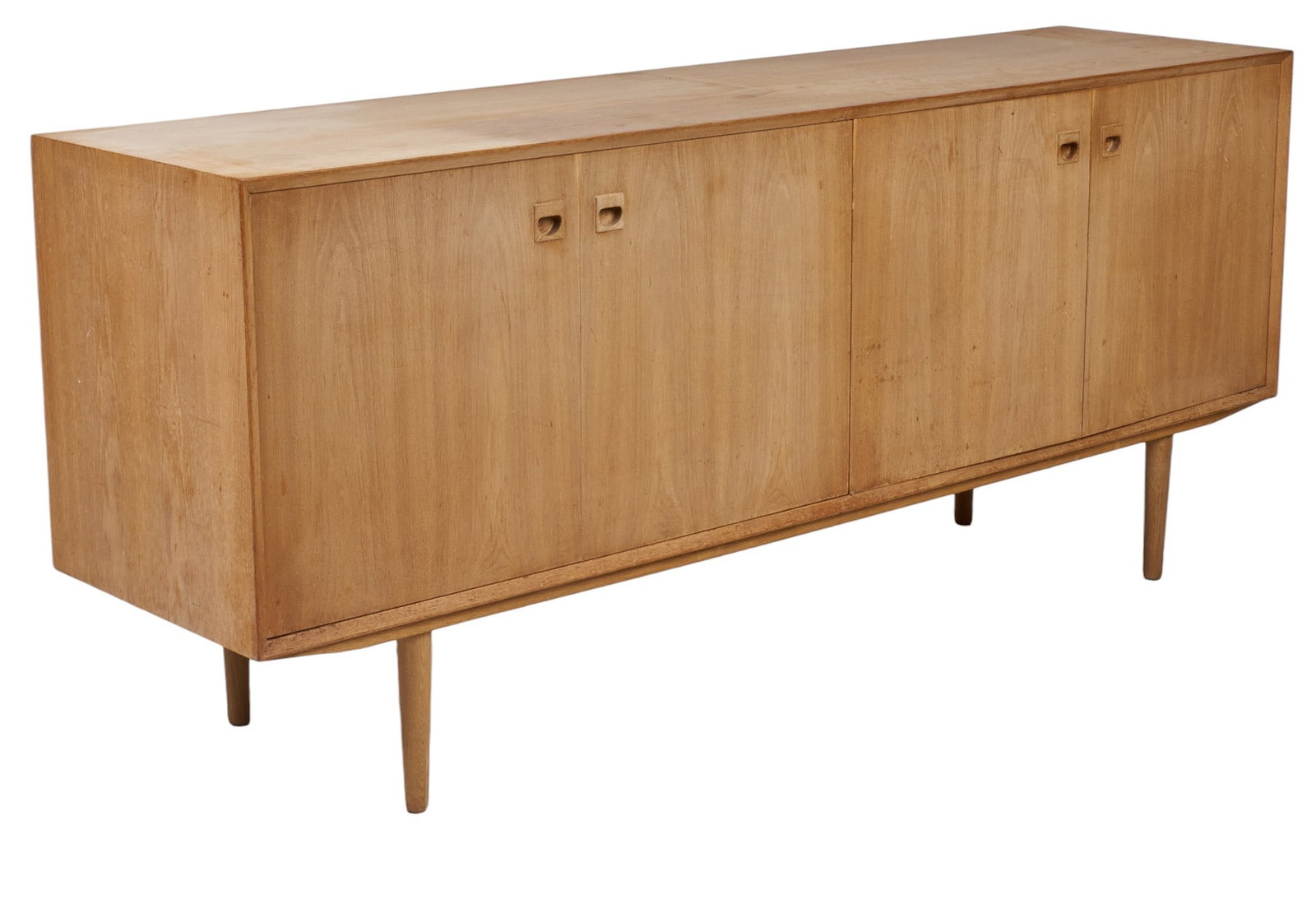 Blonde Danish Mid-Century Credenza: Blonde Danish mid-century credenza with two accordion doors opening to large cabinet, flatware trays, and single shelved cabinet height 33.5 in. x width 79 in. x depth 20 in. 