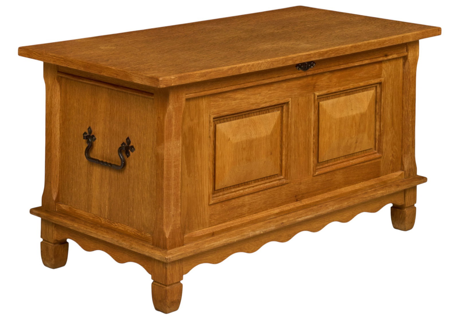 Danish Mid-Century Oak Blanket Chest: Danish mid-century oak blanket chest, hinged rectangular top above paneled case, iron side handles and lock plate, scalloped apron, raised on short shaped feet height 23 in. x width 44 in. x depth