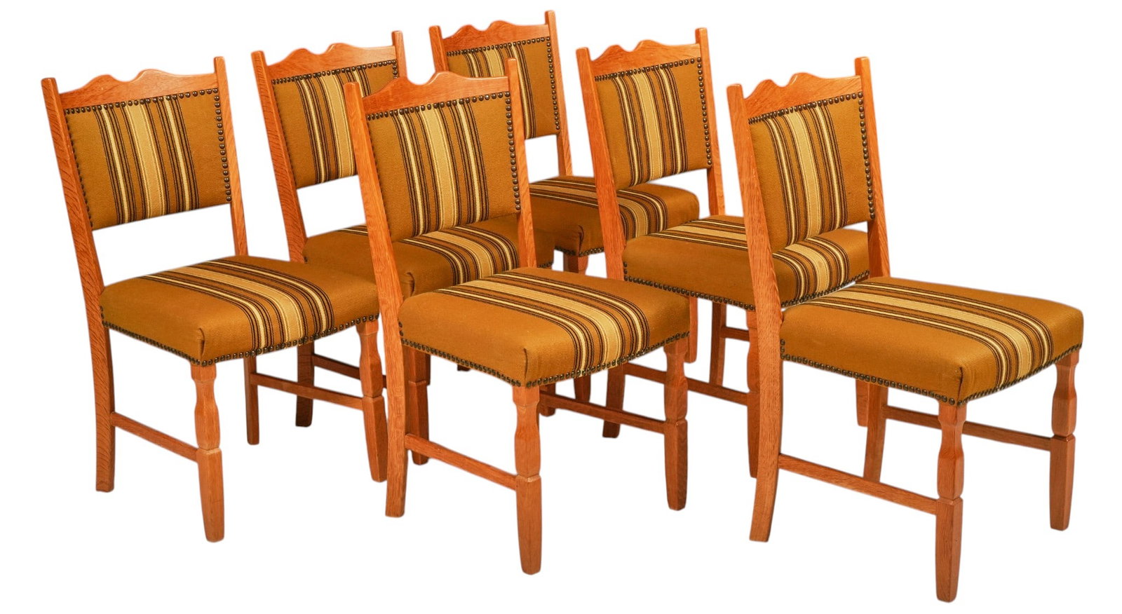 Set of (6) Danish Mid-Century Oak Dining Chairs: Set of six Danish mid-century oak dining chairs, shaped crest rails, upholstered backs and seats in striped ochre textile with brass nailhead trim, turned front legs joined by stretchers height 36.5 i
