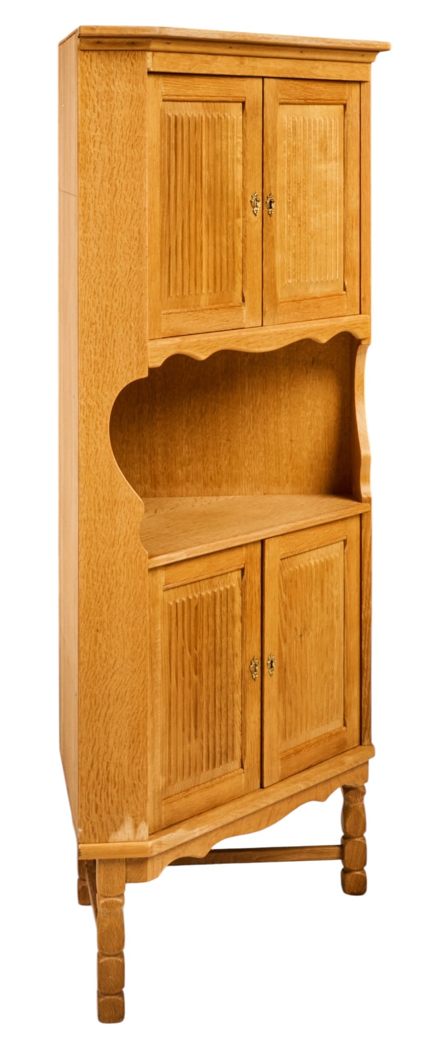 Henning Kjaernulf, Mid-Century Corner Cabinet: Henning Kjaernulf (Denmark) oak mid-century corner cabinet with carved upper and lower cabinet doors, both opening to shelved interiors, supported on faceted block legs, includes one key height 6