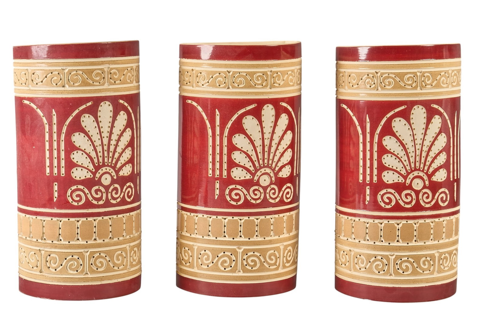Beaumont Mood, (3) Custom Ceramic Sconces: Set of three custom Beaumont Mood (San Antonio, Texas) glazed ceramic semi-cylinder wall sconces with single-bulb fixture, featuring perforated decoration and palmette and scroll motif,
