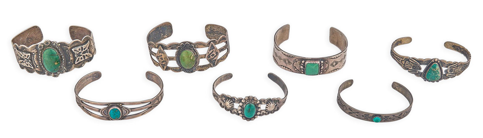 (7) Vintage Southwestern Sterling & Green Turquoise Cuffs: Seven vintage Southwestern sterling silver cuff bracelets, each set with turquoise cabochons and stamped details, marked Circumference: 6.5 in. / largest Total weight: 143.3 g Provenance: Propert