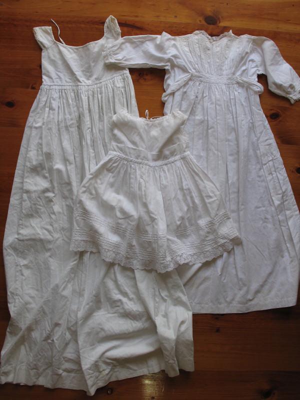 Seven Antique 'Girls Petticoats', white cotton: Seven Antique 'Girls Petticoats', white cotton 43cm-106cm, ideal for dolls. Plus two Antique whitewear nightgowns 63-82cm lg. All cleaned.