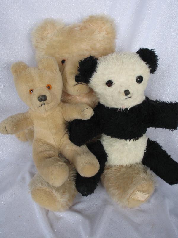 Three unjointed Wendy Boston bears 1970s. Seated 26cm: Three unjointed Wendy Boston bears 1970s. Seated 26cm Panda, a replaced left eye. Blonde plush bear 51cm & Playsafe 30cm cotton plush.