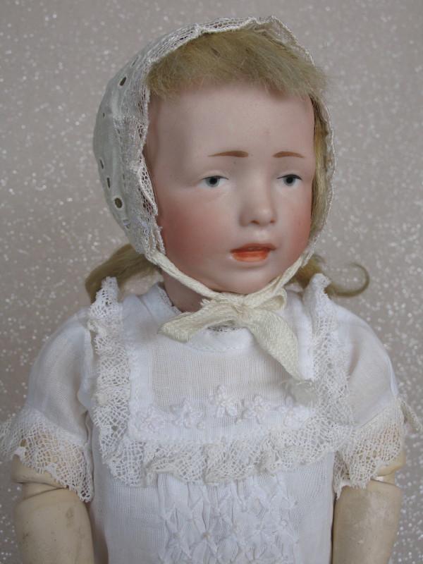 Very scarce Kammer & Reinardt 112 "Elsa" Character: Very scarce Kammer & Reinardt 112 "Elsa" Character Child c1909 bisque 12" (31cm) incised 'KstarR//112'. Hairline from back pate rim to mark under the wig, also faint from center forehead to left ear/e
