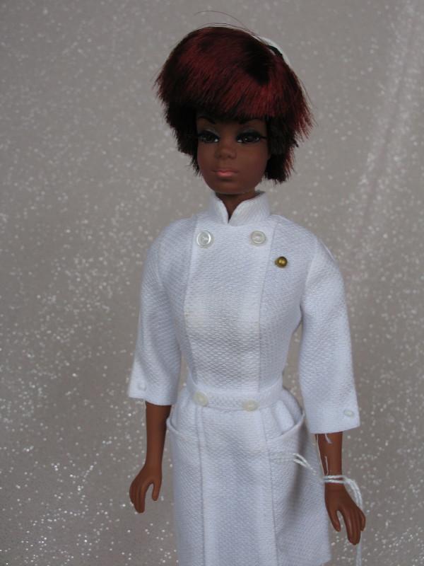 Mattel Barbie Julia TNT 1969 Diahann Carrol. Knees: Mattel Barbie Julia TNT 1969 Diahann Carrol. Knees click OK, nurse hat, tagged white dress, undies and white shoes, red/black hair.