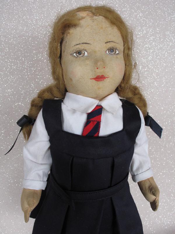 Unknown Felt cloth doll 15" (38cm). Formed felt: Unknown Felt cloth doll 15" (38cm). Formed felt attached face with painted features, brown eyes, closed red mouth, applied mohair wig with plaits and bald spot at back. Cotton/wood fill body with swiv