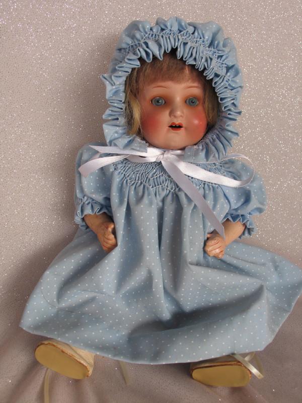 Composition Ernst Heubach 320 baby 12" (31cm). Blue: Composition Ernst Heubach 320 baby 12" (31cm). Blue glass sleep eyes, feathered brows, o/mouth with two teeth. Mohair original wig/pate with extra added hair, some wig pulls. Five piece composition bo