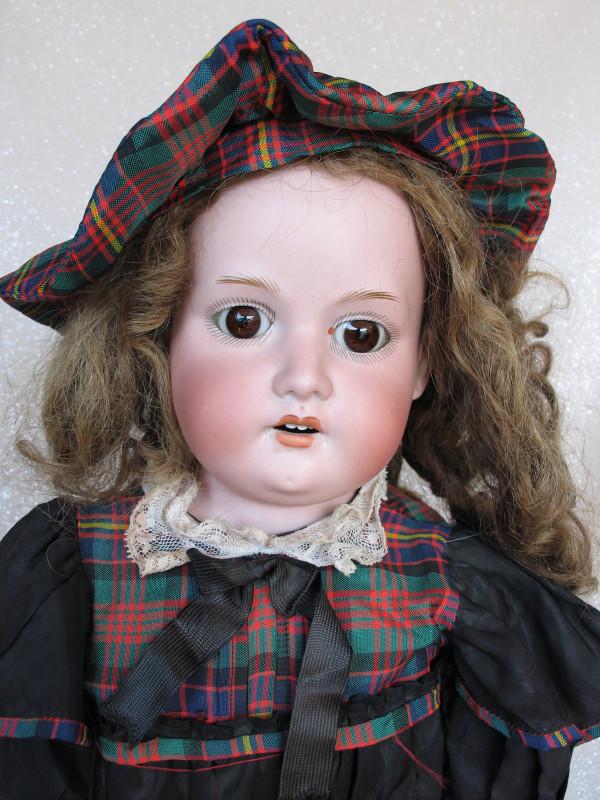 German Armand Marseille 370 bisque 24" (61cm) doll.: German Armand Marseille 370 bisque 24" (61cm) doll. Open pink mouth with red peak accents, four upper teeth. Brown glass eyes have been fixed, angled lashes, short gloss feathered brows. Vintage brown