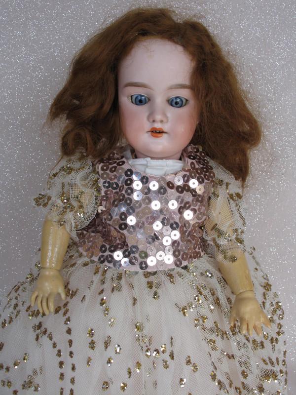 Bisque Armand Marseille "Cama" 16" (41cm). Applied: Bisque Armand Marseille "Cama" 16" (41cm). Applied replaced mohair wig/pate, blue glass eyes, vertical faint lower lashes, open pink mouth with peak accents and upper teeth. Ball jointed composition b
