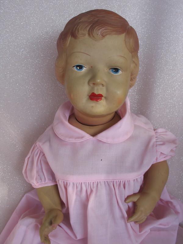 Celluloid Palitoy 55cm Toddler sometimes referred to: Celluloid Palitoy 55cm Toddler sometimes referred to Princess Elizabeth, original painted features, deep molded hair, pink cotton dress, undies, socks.