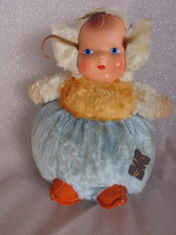 Boxed Effanbee "Butterball" brown vinyl baby 28cm, box: Boxed Effanbee "Butterball" brown vinyl baby 28cm, box has wear. Also 21cm Chiltern chime "Roly Poly" 1940s with red print tag.