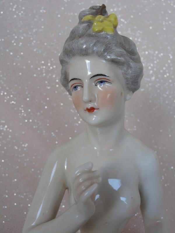 French Half Doll Dressel & Kister Arms Away turned head: French Half Doll Dressel & Kister Arms Away turned head 7" (18cm), blue bishop's staff/B. Powdered grey upswept hair with yellow bows and gold hatpin broken at tip. Pink tint porcelain, painted featur