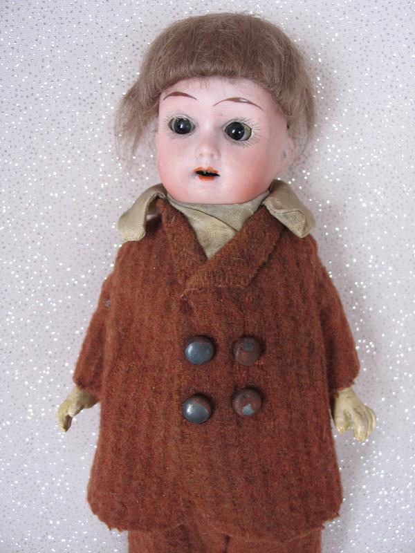 All original Walther & Sohn 200 bisque 9" (23cm) boy.: All original Walther & Sohn 200 bisque 9" (23cm) boy. Back hairline from pate rim. Brown glass s/eyesopen mouth with upper teeth. mohair wig. Straight leg five piece composition body. Brown shorts and