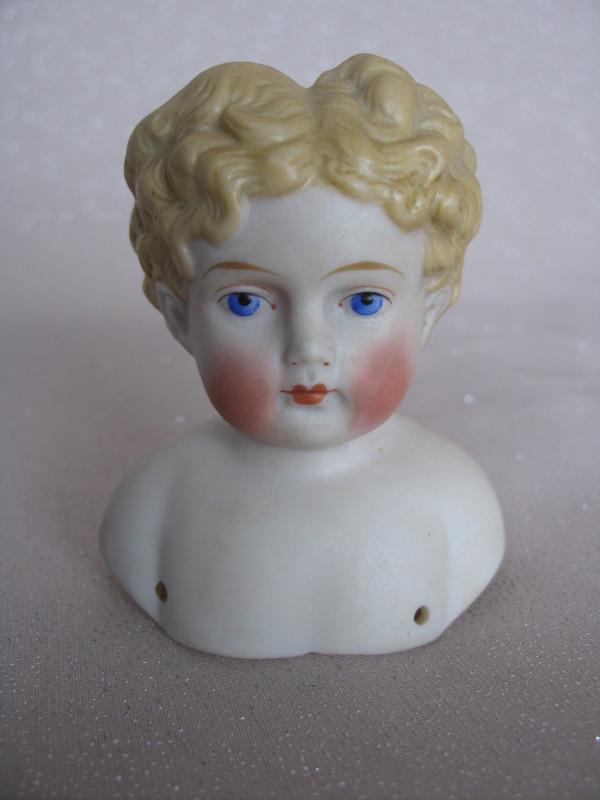 Two 1880s German shoulder heads only:- Parian 10. 5cm (1 of 3)