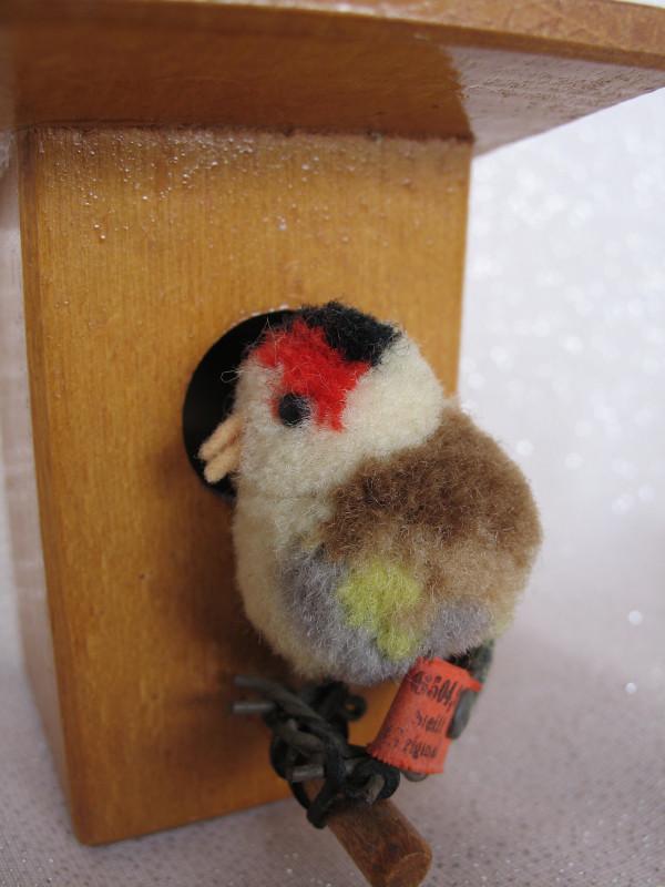 Scarce Steiff Finch Birdhouse . Wool pom-pom Finch bird: Scarce Steiff Finch Birdhouse . Wool pom-pom Finch bird with 1934-36 red tag 6504 . 9/ underscored button 4cm, swivel head, felt tail/beak and wire feet . Wire attached feet to dowel perch on wood bir