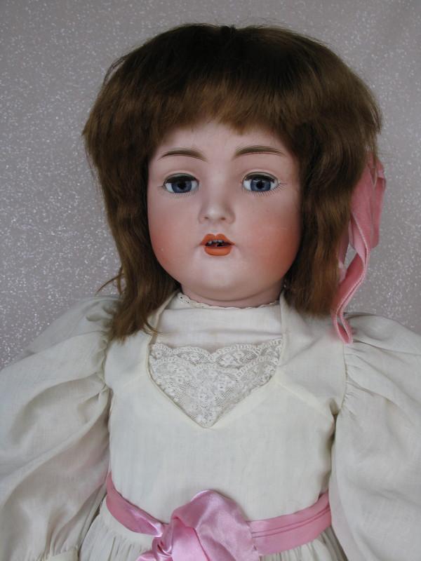 German Bruno Schmidt character child 29" (74cm) c1900s: German Bruno Schmidt character child 29" (74cm) c1900s . Blue glass sleeping eyes, angled lashes, replaced lashes, molded feathered brows . Open mouth with peak accents and four upper teeth, tipped to
