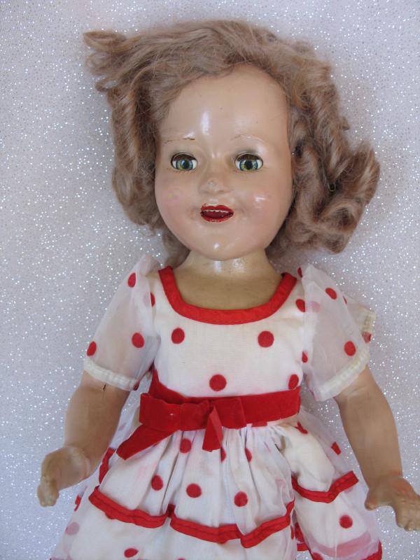 Composition Canadian Reliable Shirley Temple late 30s: Composition Canadian Reliable Shirley Temple late 30s 15" (38cm) . Sleep eyes, real lashes, open red mouth, upper teeth, applied mohair wig . Wearing 1974 Ideal red coin dot tagged dress, socks, and c