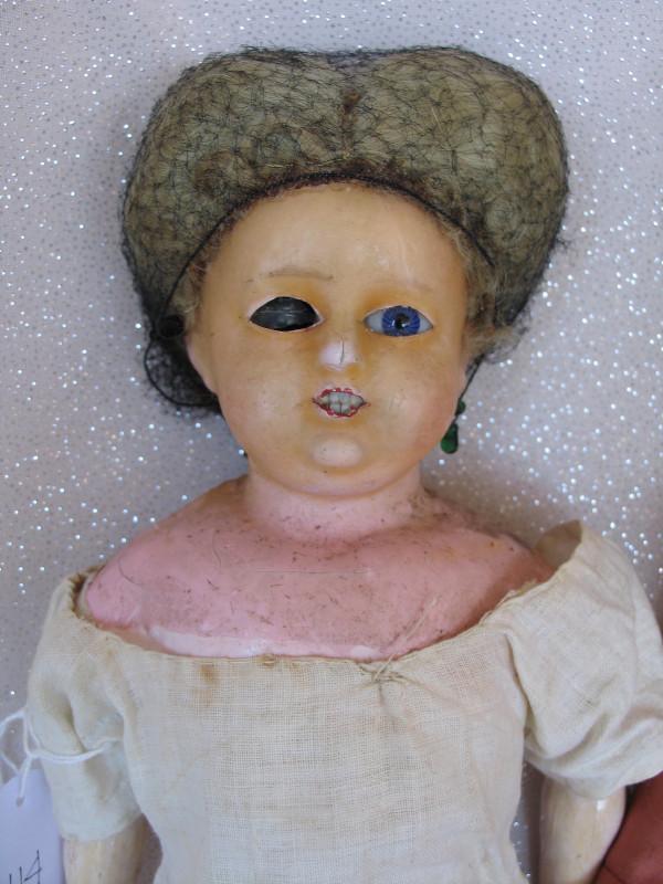 Weary Sonneberg wax-over papier mache 15" (38cm): Weary Sonneberg wax-over papier mache 15" (38cm) c1880-90s shoulderhead . Inserted blue spiral threaded eyes with right back in head, open mouth with upper lower teeth . Applied mohair center part wig