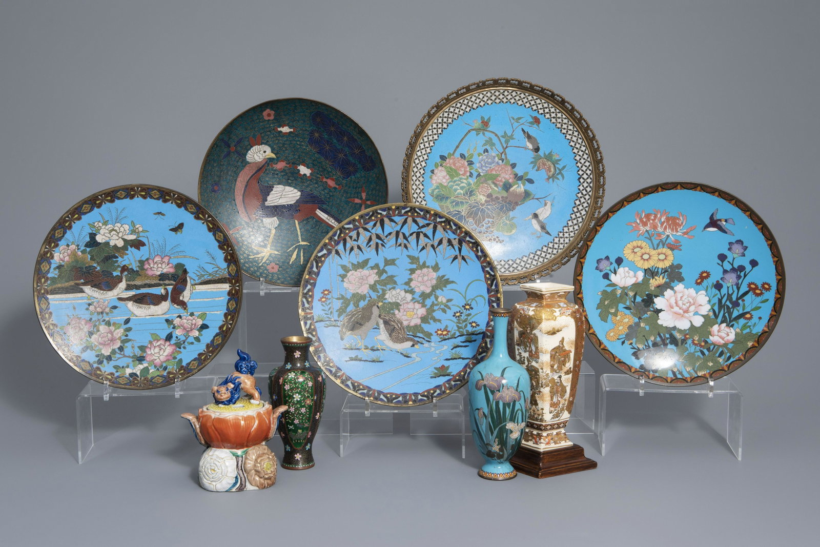 Five Japanese cloisonnÃ© dishes and two vases, a: Five Japanese cloisonnÃ© dishes and two vases, a Satsuma vase and a lotus shaped jar, Meiji, 19th C. H 18,8 cm (the lotus shaped jar)Â H 24 - 18,8 cm (the largest and the smallest vase without th
