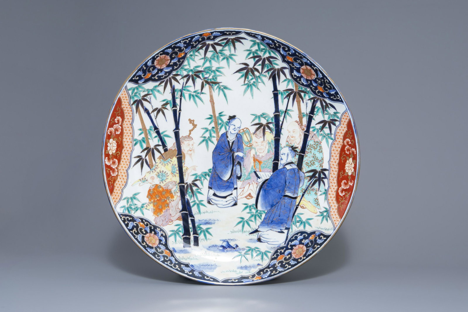 A large Japanese Imari charger with figures in a: A large Japanese Imari charger with figures in a landscape, Meiji, 19th/20th C. Dia.: 61 cm