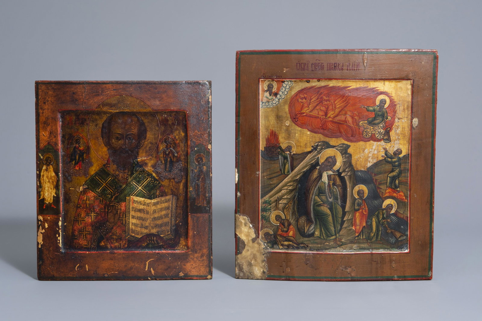 Two Russian icons, 'Ascension of Elijah into the: Two Russian icons, 'Ascension of Elijah into the heavens' and 'Saint Nicholas', 19th C. 35,5 x 30 and 30,7 x 26,5 cm
