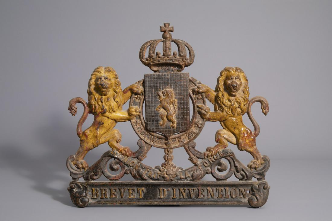 A metal wall plaque with the motto of the Belgian state: A metal wall plaque with the motto of the Belgian state 'L'union fait la force', N. Porta & Cie, Huy, late 19th C. -- Description: 54,5 x 48,5 cm The reverse marked 'N. Porta & Cie - Huy'. The f