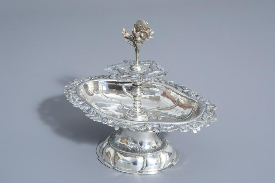 A silver centerpiece with floral design, Germany,: A silver centerpiece with floral design, Germany, probably Zwickau, maker's mark I.M. (?), 19th C. -- Description: H 18,2 - L 20,5 - D 15 cm Weight: 364 g