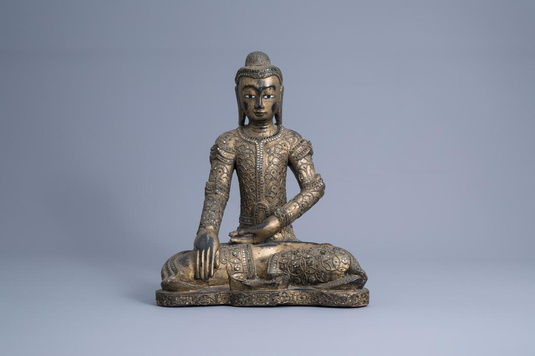 A tall inlaid gilt wood figure of a seated Buddha, (1 of 7)