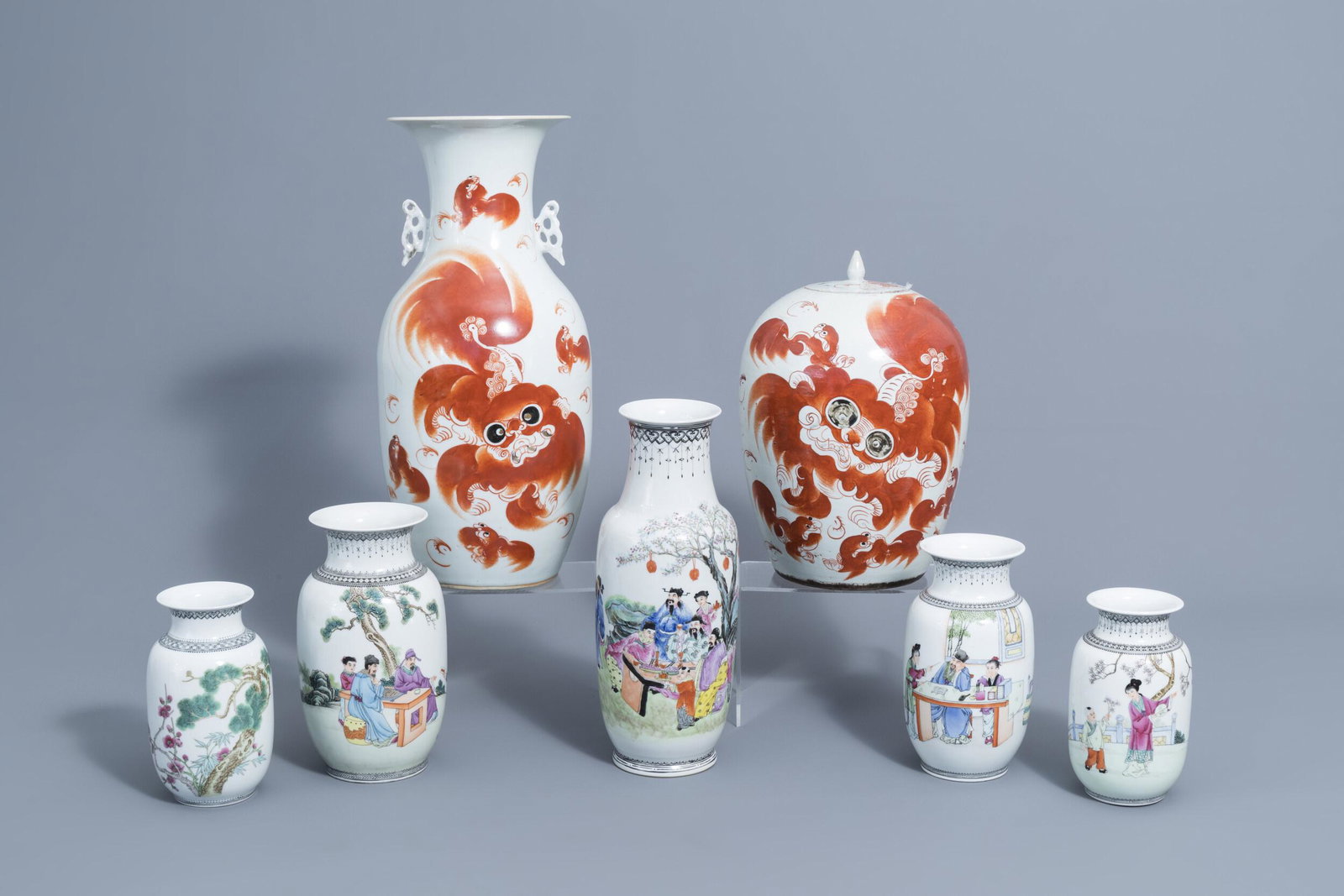 A Chinese iron red vase and jar and cover with Buddhist: Full title: A Chinese iron red vase and jar and cover with Buddhist lions and five famille rose vases, 19th/20th C. Description: H 44,5 - 18 cm (the tallest and the smallest vase) Condition:Please con