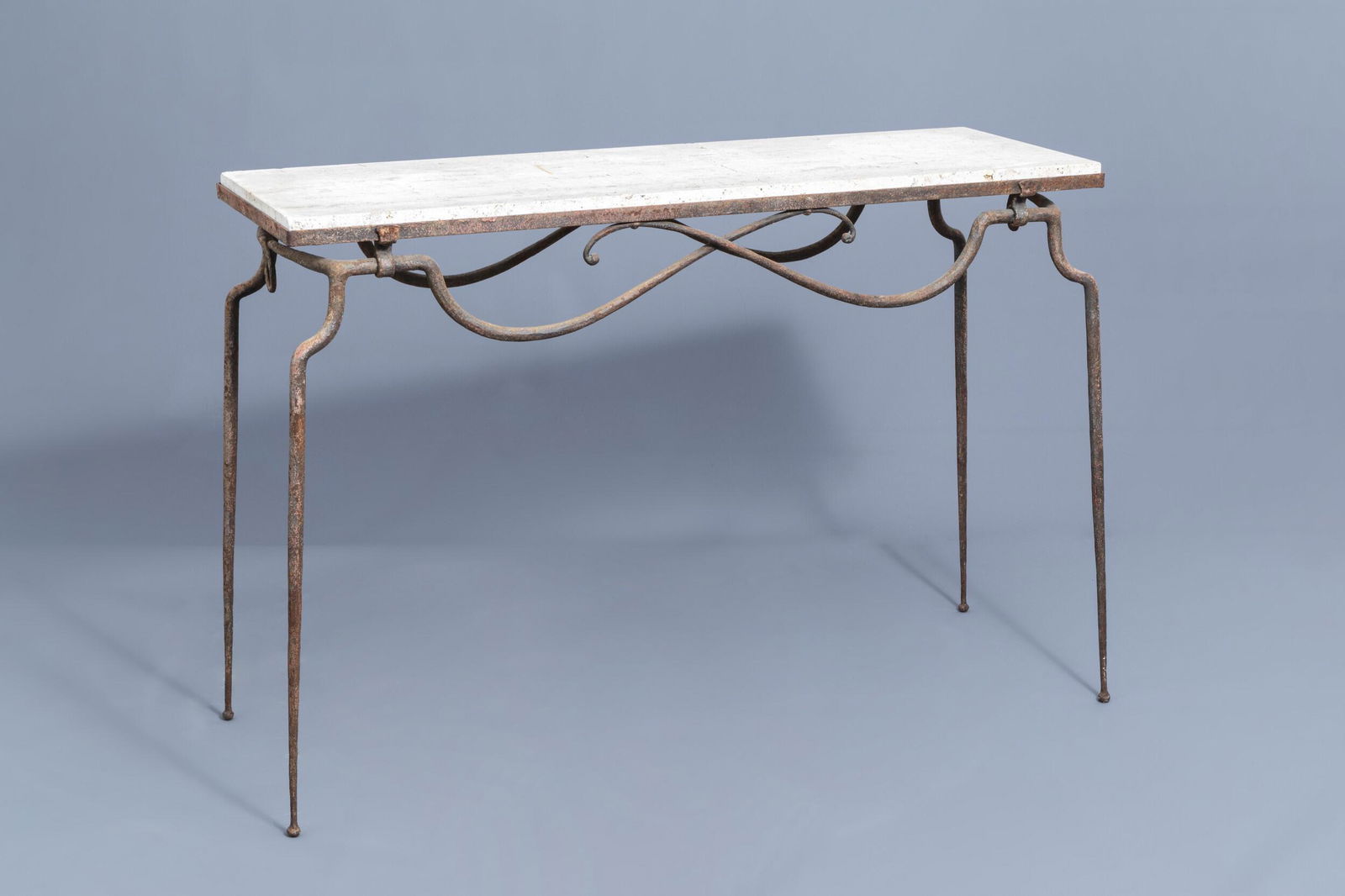 Attributed to RenÃ© Prou (1889-1947): A wrought iron: Full title: Attributed to RenÃ© Prou (1889-1947): A wrought iron console table with 'pierre de Bourgogne' top, mid 20th C. Description: H 62,7 - L 90,8 - D 30,7 cm Condition:Please contact us to let