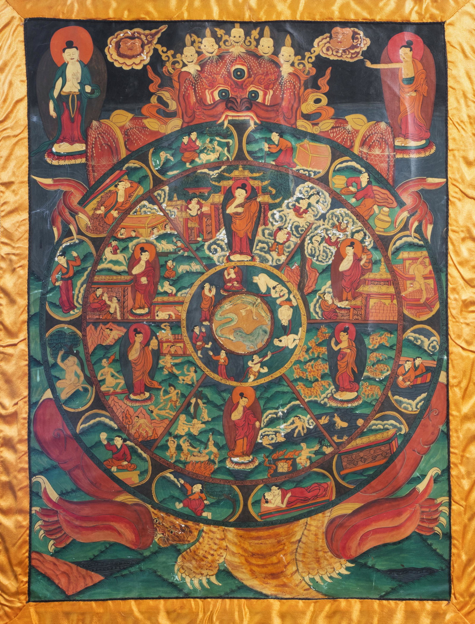 A 'Bhavacakra' thangka or 'Wheel of life' thangka,: Full title: A 'Bhavacakra' thangka or 'Wheel of life' thangka, Tibet, 20th C. Description: Work: 110 x 68,5 cm Frame: 112 x 70,5 cm Condition:Please contact us to let us know which lots are of interes