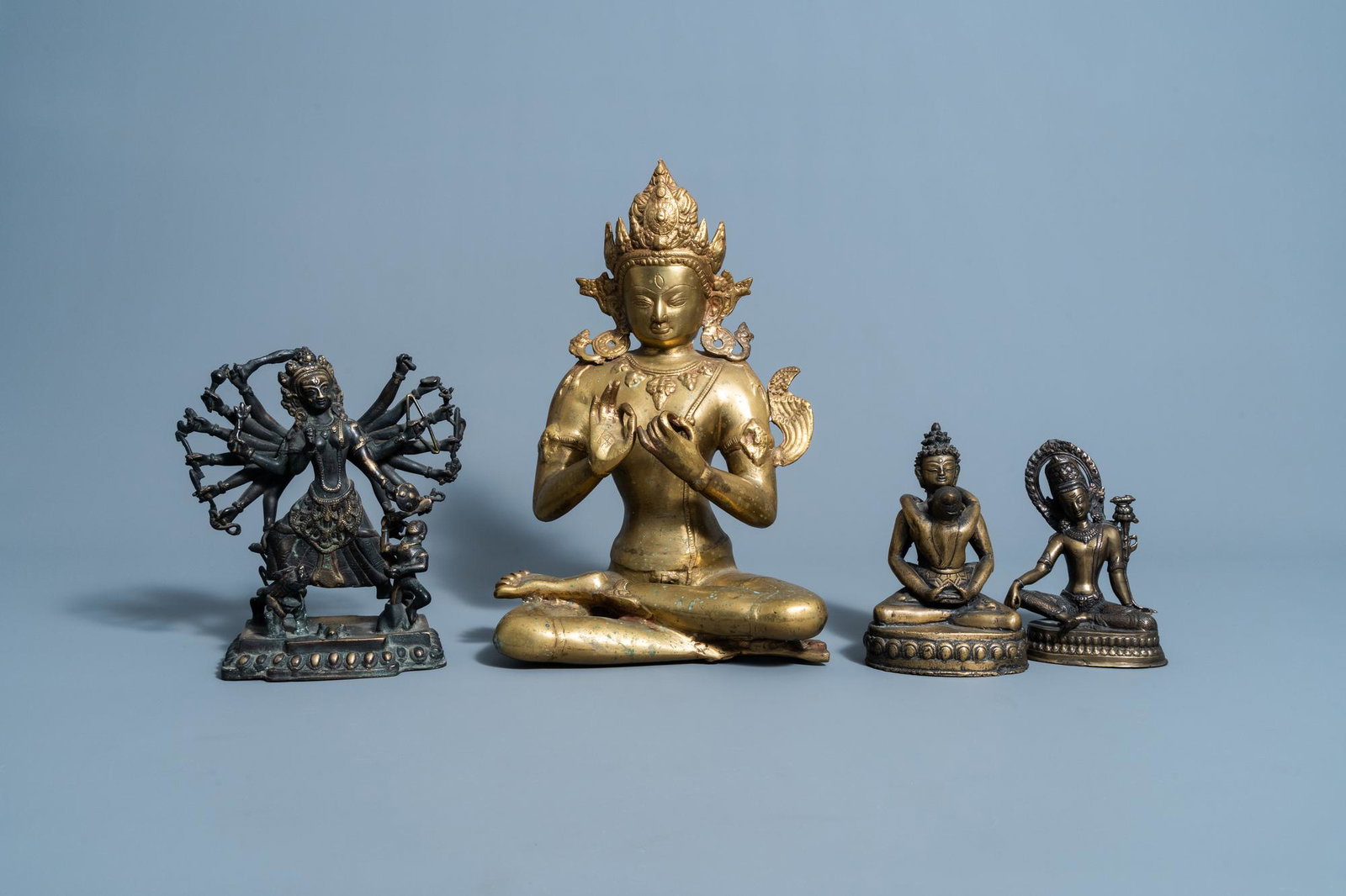 Four various Sino-Tibetan brass and copper figures, (1 of 8)