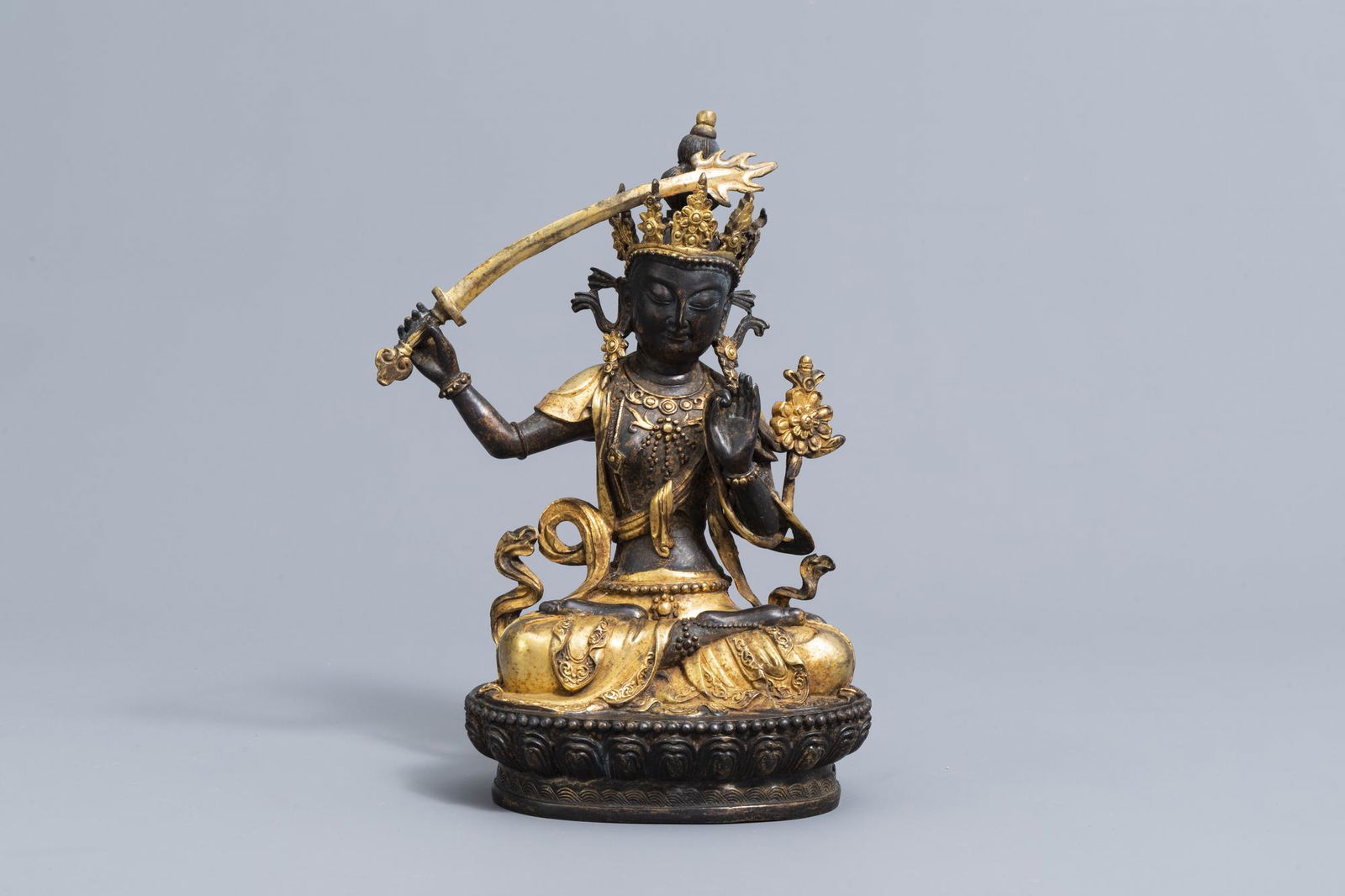 A Sino-Tibetan parcel-gilt bronze figure of Manjusri, (1 of 7)