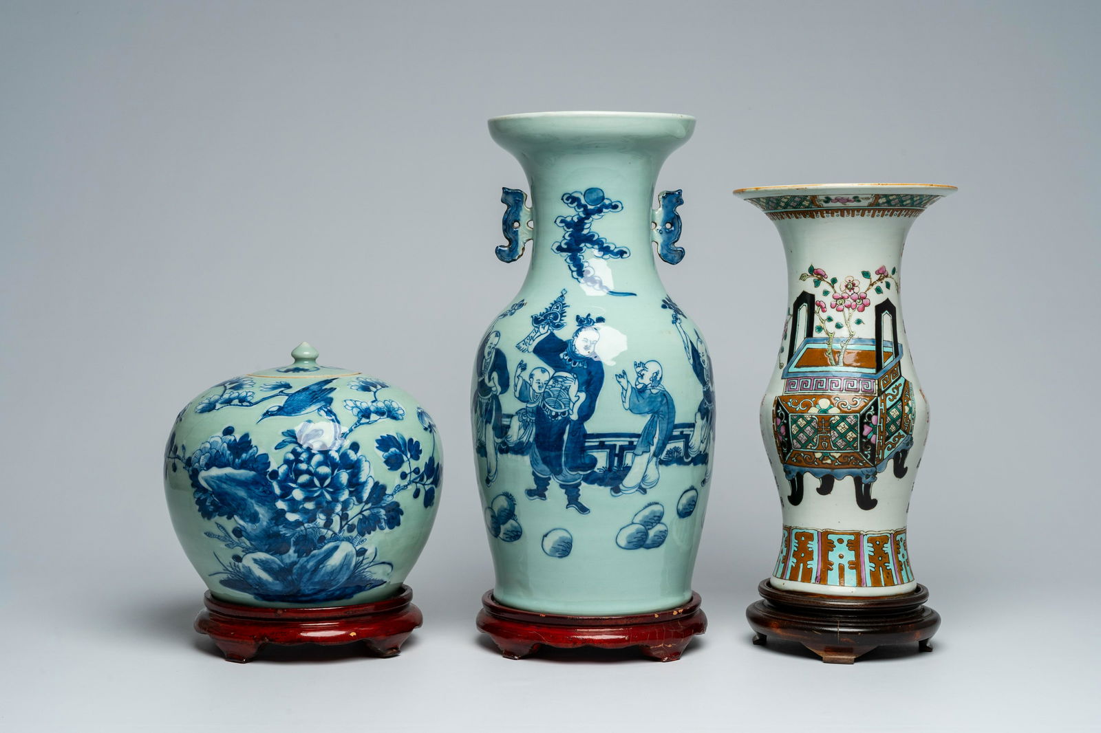 A Chinese blue and white celadon ground vase with figures in a garden, a ginger jar and a famille: H 46,8 - 40,7 cm (the vases with base) H 43,1 - 35,8 cm (the vases without base) H 27 - 23 cm (the ginger jar with and without base)