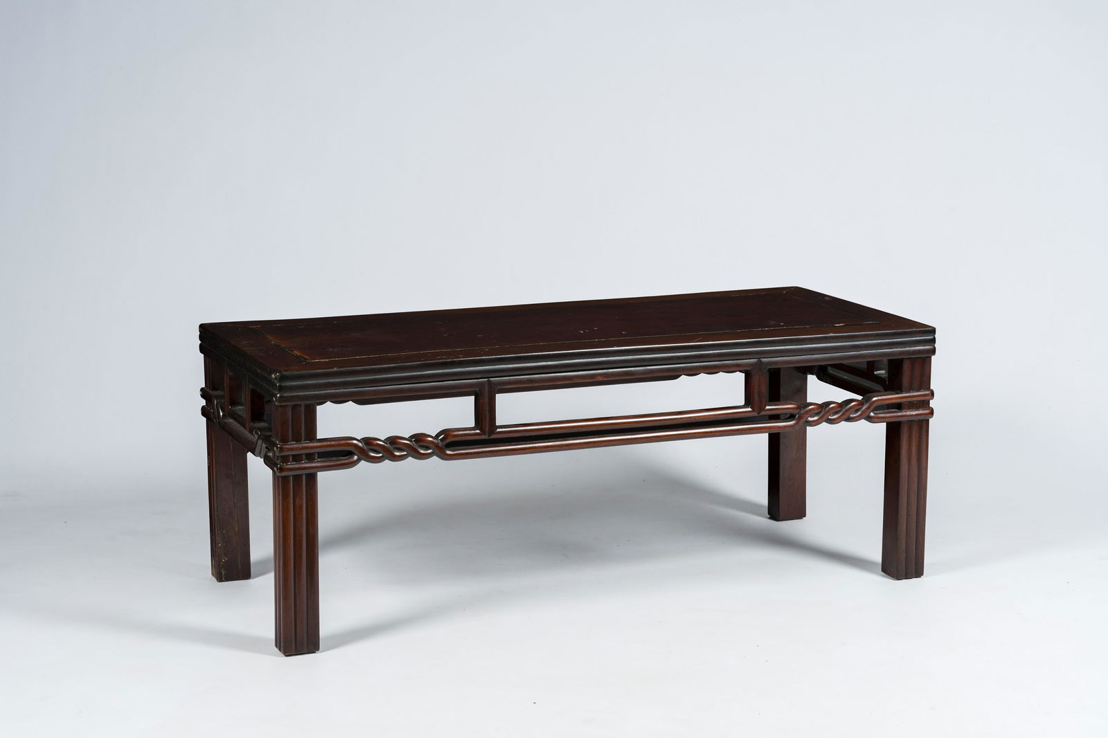 A Chinese rectangular wood 'kang' table, 20th C. (1 of 7)