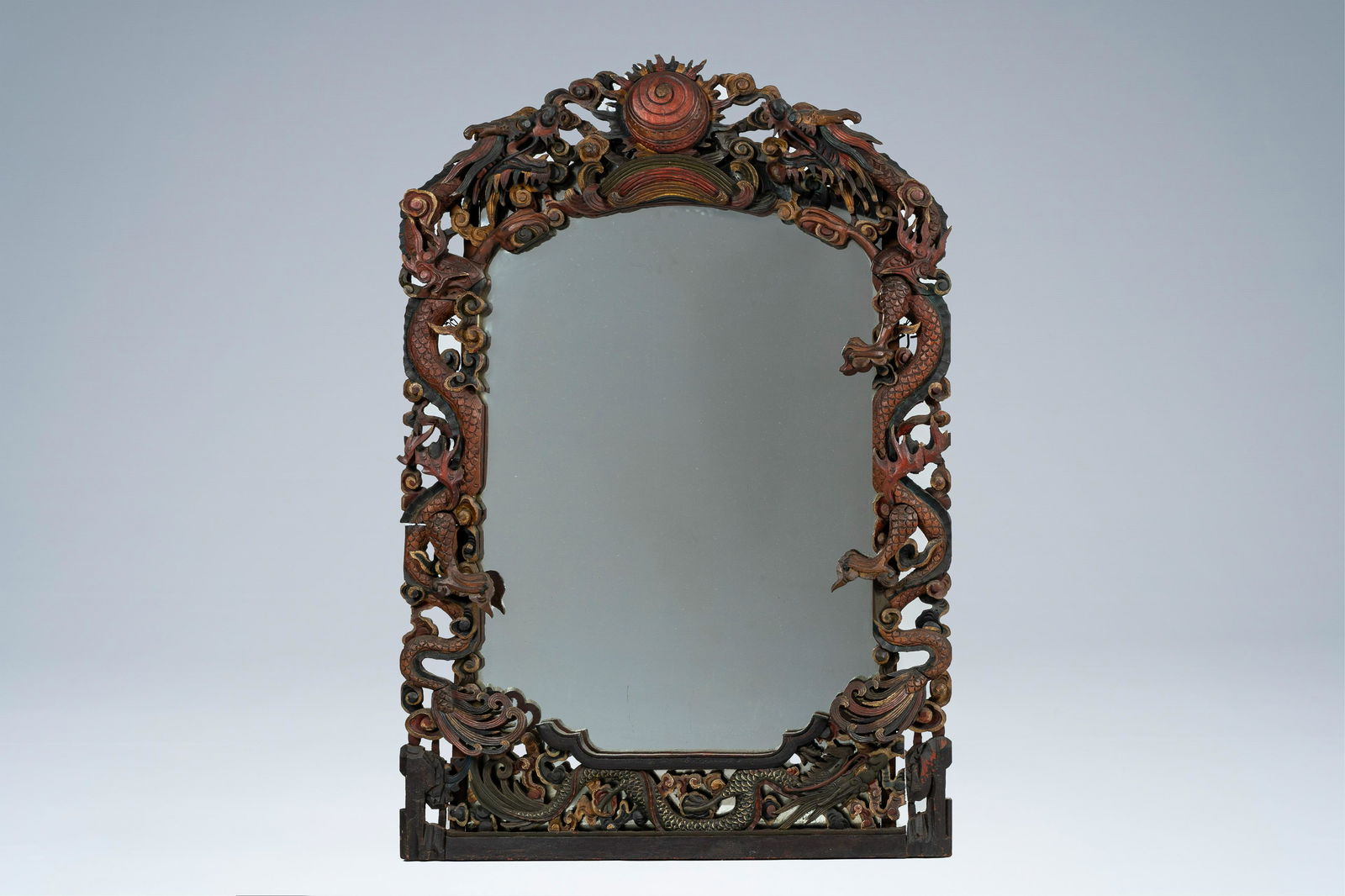 A Japanese open worked, carved, polychrome painted and gilt wood 'dragon' mirror, 19th/20th C. (1 of 3)