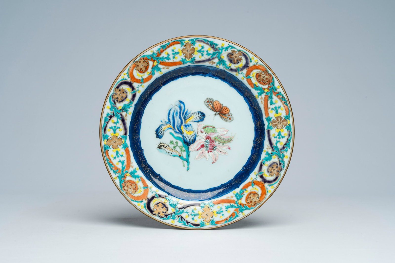 A Chinese famille rose 'botanical' plate after Maria Sybilla Merian, Qianlong (1 of 2)