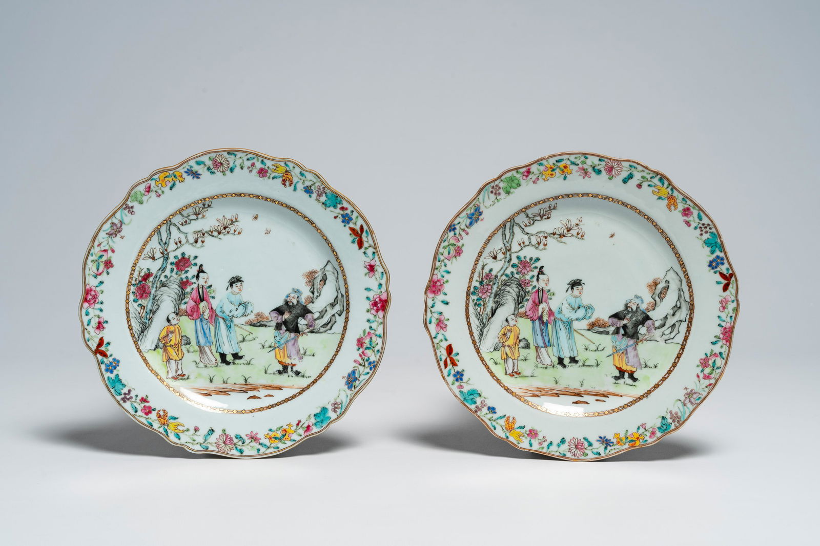 A pair of fine Chinese famille rose plates with figures in a garden, Qianlong (1 of 2)