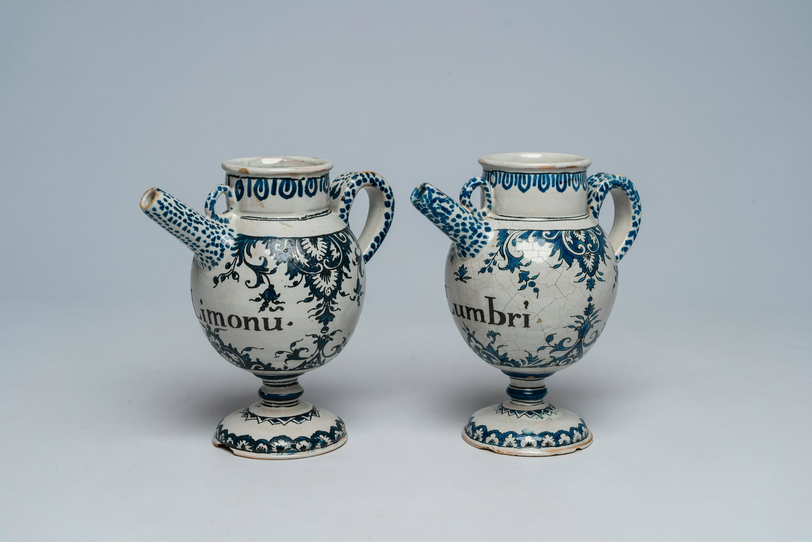 A pair of French blue and white syrup jars or wet drug jars with floral design, Rouen, 17th/18th C.: Full title: A pair of French blue and white syrup jars or wet drug jars with floral design, Rouen, 17th/18th C. Description: H 19,5 - L 19 cm (the tallest jar) H 19,2 - L 19,2 cm (the smallest jar) Th