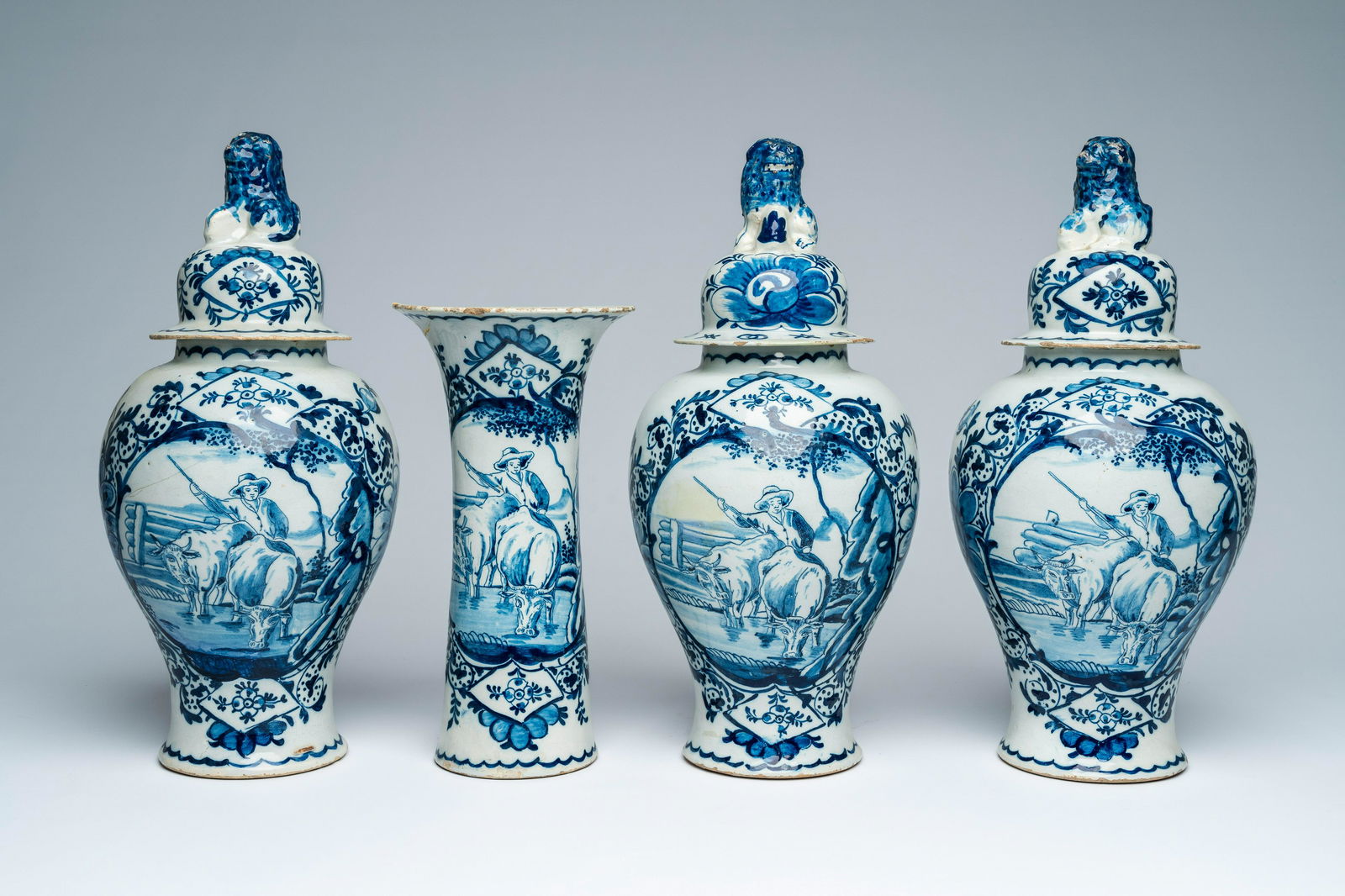 A Dutch Delft polychrome four-piece vase garniture with a shepherd, 18th C. (1 of 6)