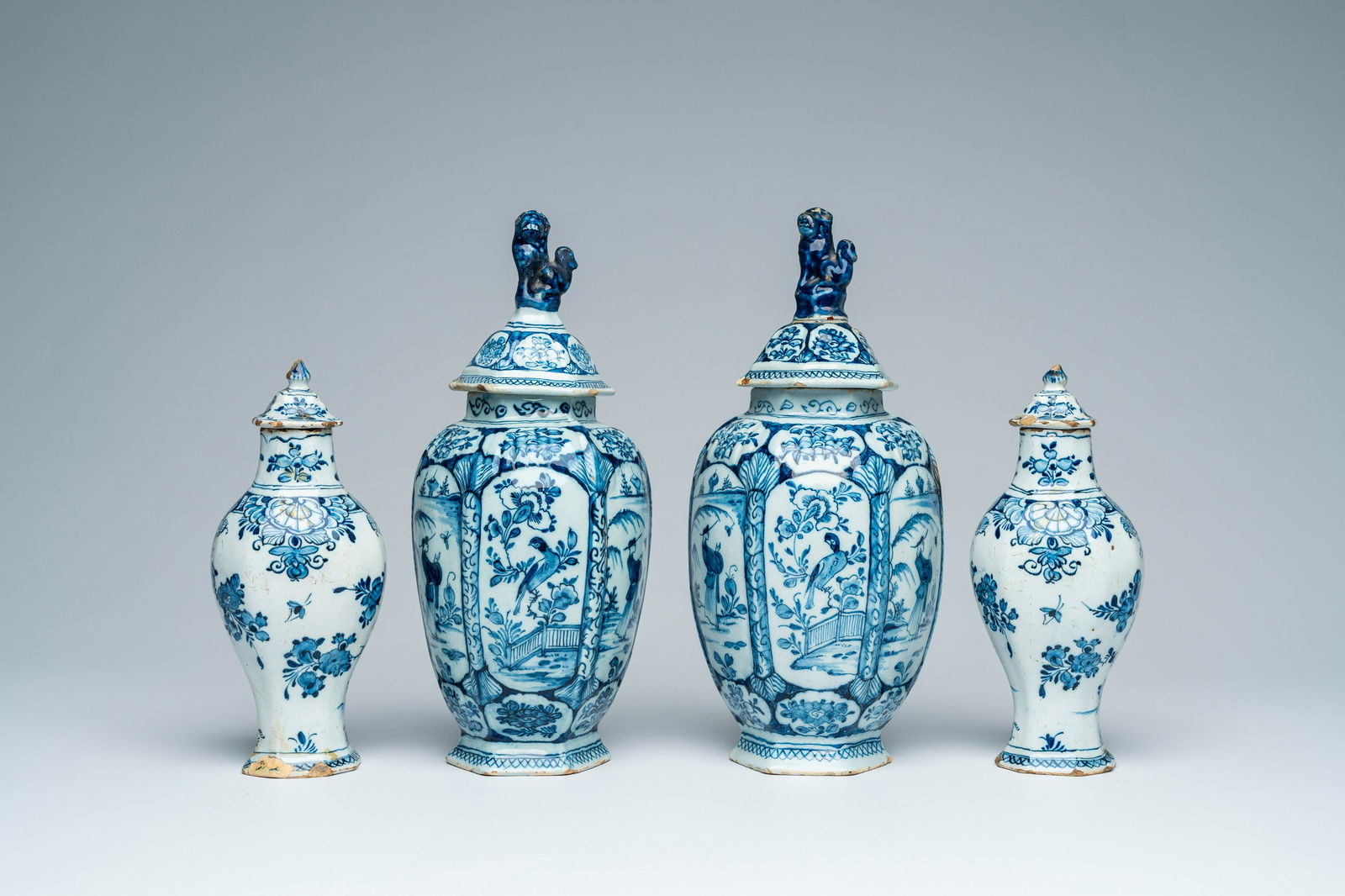 Two pairs of Dutch Delft blue and white vases and covers with animated scenes and floral design, (1 of 6)